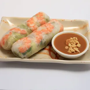 #9 shrimp spring rolls  are fresh wrapped rice paper with shredded lettuce, mint, bean spouts and vermircelli