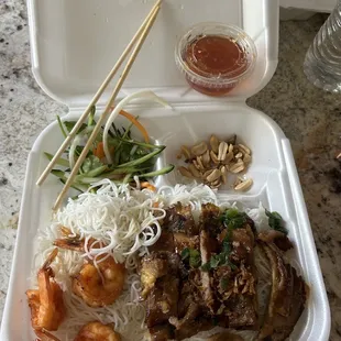 Grilled pork with shrimp and eggroll vermicelli dish