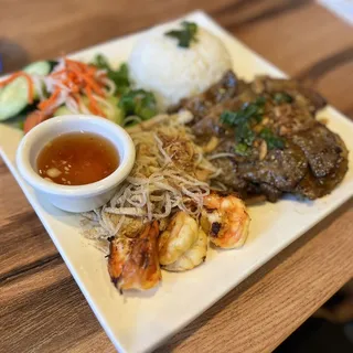 G16. Grilled Pork, Shrimp, Shredded Skin & Egg Roll Over Rice Plate
