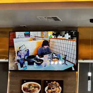 The restaurant was playing the famous foodie influencer @Rainaiscrazy YouTube videos while she was dining there.., lol