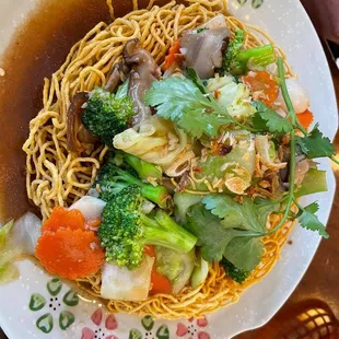 a plate of noodles and vegetables