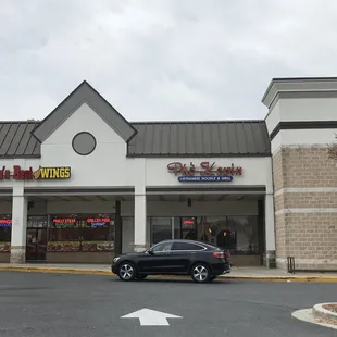 a car parked in front of a restaurant