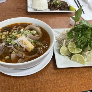 Spicy pho with shredded cabbage and bean sprouts.