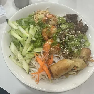 B2. Grilled Shrimp and Pork Over Vermicelli Noodle with 1 Egg Roll