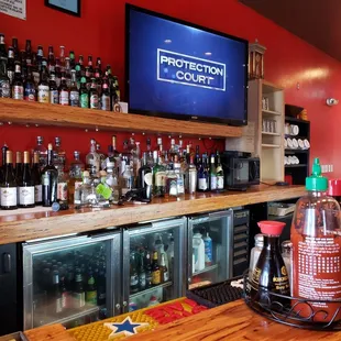 a bar with bottles of alcohol