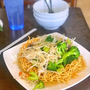a plate of noodles and broccoli