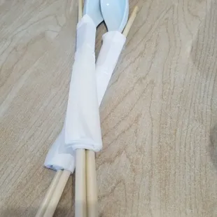 a pair of chopsticks and an umbrella