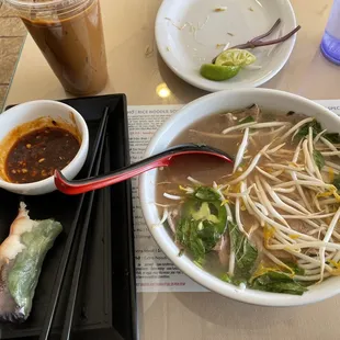 a bowl of soup and a plate of rice rolls