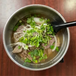 an overhead view of a bowl of soup