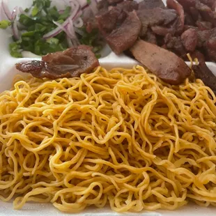 Egg noodles, grilled pork, and crudite packaged separately from broth to go.