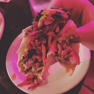 Pork taco with mango salsa and pickled apples