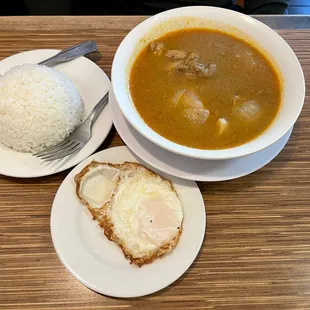 Chicken curry with side of fried egg