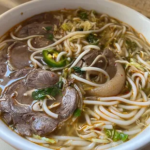 a bowl of beef and noodles