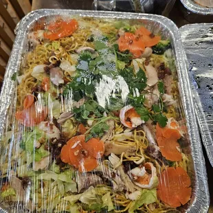 two trays of food on a table