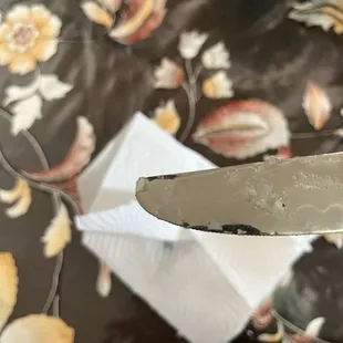 Melted plastic on a butter knife