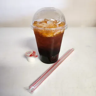 Medium Thai Tea, with boba layered beneath the ice and finished with cream on the top.