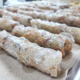 freshly prepared pork egg rolls ready to be fried!