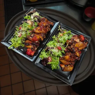 Raspberry Chipotle Wings with field leaf salad.