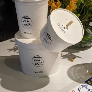 three cups of ice cream on a table