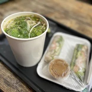 Beef pho cup and shrimp spring rolls with peanut sauce