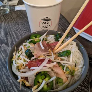 Minor size (32 oz) pho with thin rice noodles, smoke brisket and beef broth,. $8.99 prior to tax ($9.78 after tax)