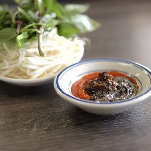 a bowl of soup and a bowl of noodles
