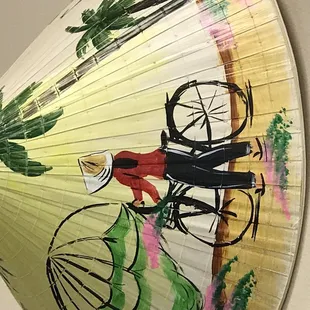 a painting of a woman on a bicycle
