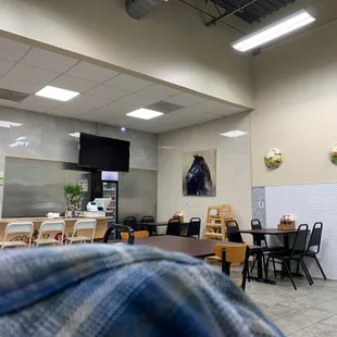 a restaurant with tables and chairs