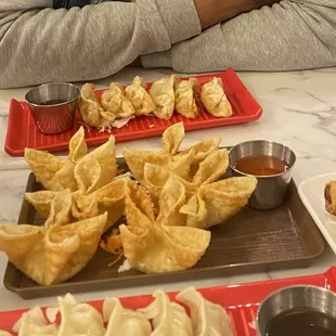 a woman sitting at a table with food