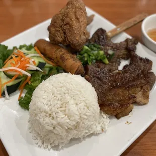 #37 - Grilled Pork Chop, Fried Chix Wings, Egg Rolls over rice