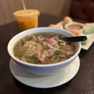 a bowl of soup with meat and vegetables