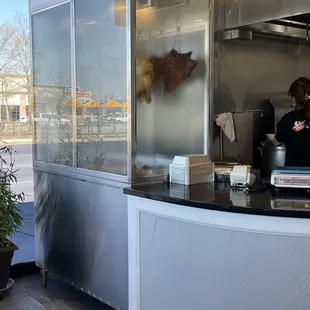 a woman standing in a food truck