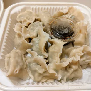 Boiled pork hand made dumplings with leeks