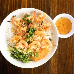 V4. Grilled Shrimp Over Vermicelli.

 Rice noodle, lettuce, cucumber, bean spout, cilantro serve with fish sauce.