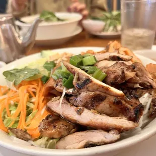 a plate of chicken and salad