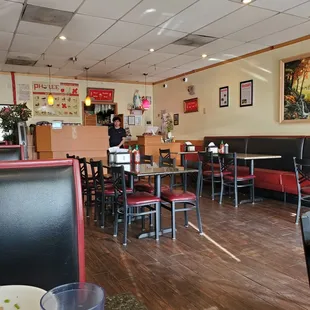 a restaurant with tables and chairs