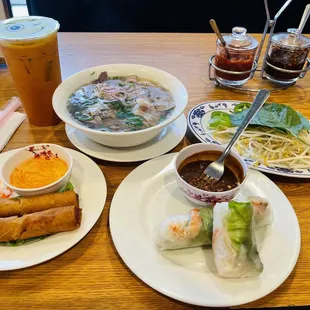 Spring rolls , egg rolls , combination meat pho and Thai tea
