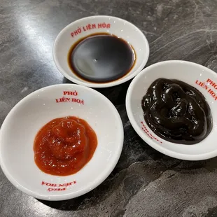 three small bowls of sauce