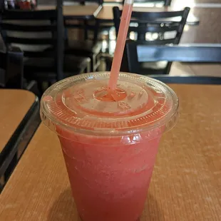a smoothie in a plastic cup