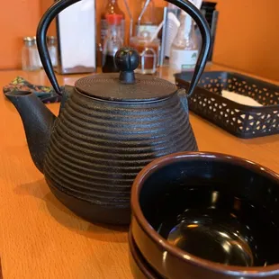 a teapot and bowls
