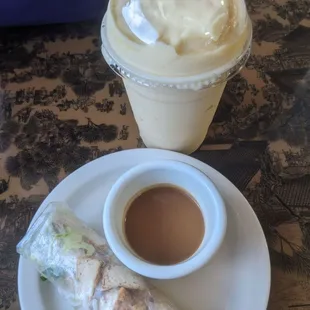 Fresh vegan tofu spring roll with peanut sauce and a vegan mango  coconut  smoothie