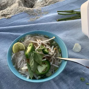 a bowl of noodles and vegetables