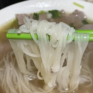 a bowl of soup with noodles and meat