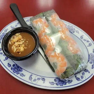 a plate of food with a dipping sauce