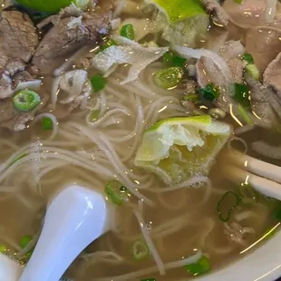 a bowl of soup with meat and vegetables
