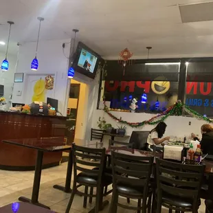 Interior of the restaurant, plenty of booths and a few larger tables.