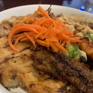 Close up of the tender and flavorful grilled meats in the combo noodle bowl.