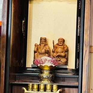 a small shrine with buddhas