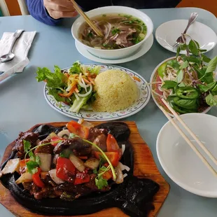 The house special pho with well done meat and filet beef mignon with yellow rice