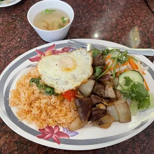 Cubed beef with tomato rice and egg. My favorite dish here